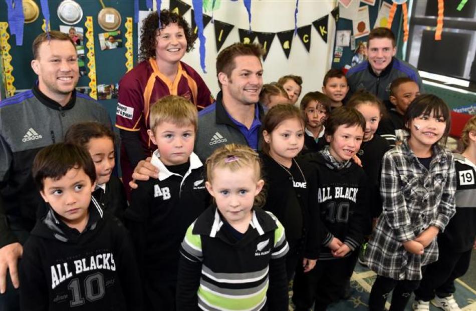 All Blacks (from left) Wyatt Crockett, Richie McCaw and Colin Slade visit Dana Turnbull's room of...