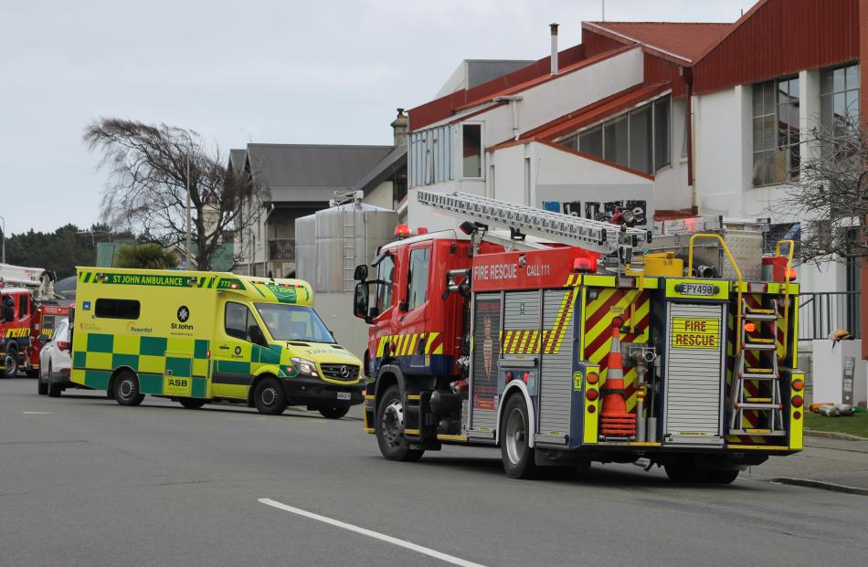 An ambulance and a fire engine outside the Blue River dairy 
...