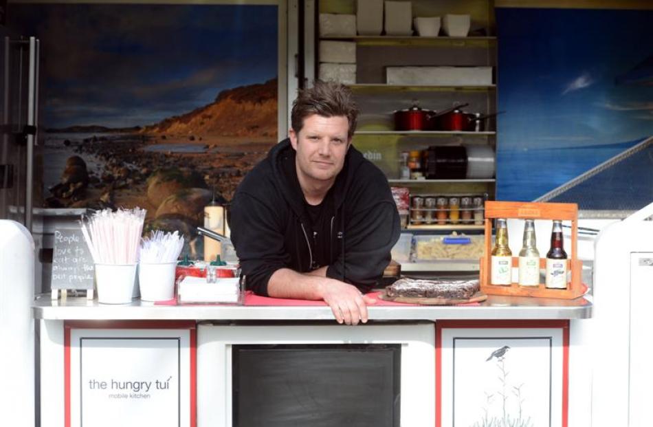 Ben Davidson works from his food truck, Hungry Tui, at the Museum Reserve. Photo by Linda Robertson