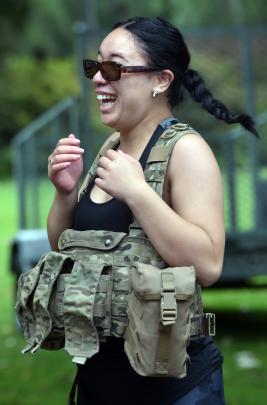 Future student R-Leah Scott, 16, of Palmerston North, tries on some army gear.