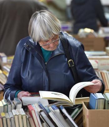 Hazel Ronald (84), of Mosgiel, takes a closer look at the book sale.