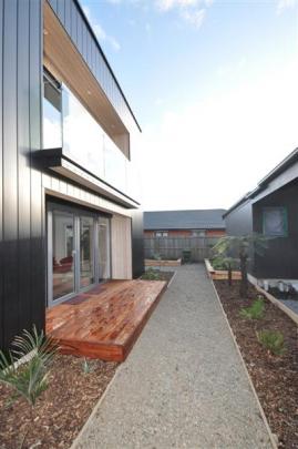 The north-facing living area opens to a deck.