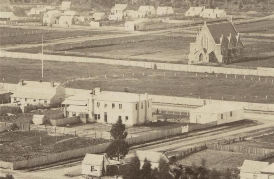 Detail from a late 1860s photograph showing the building from the rear (front, centre). All...