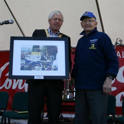 Central Mayor Tony Lepper presents Jan Belt with a framed photograph on Saturday. Photo by Liam...