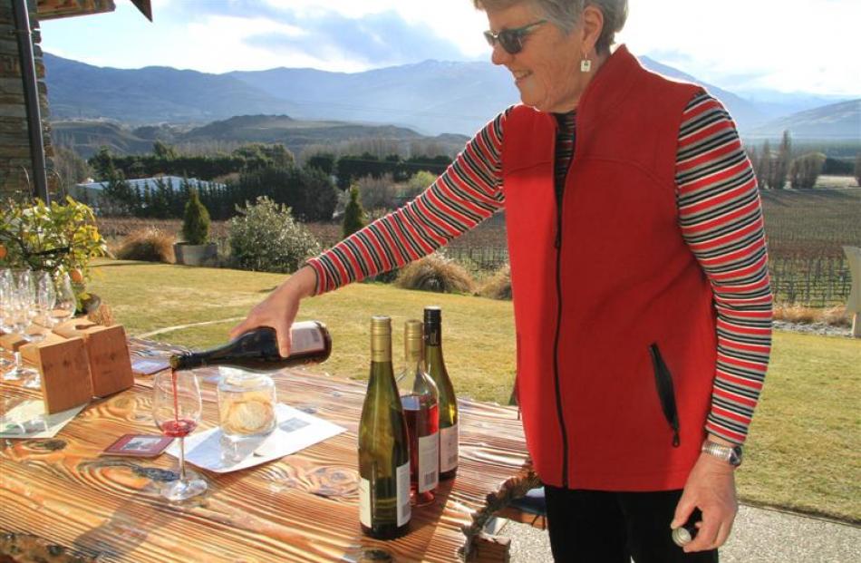 Catherine Brown pours a Bannock Brae Barrel Selection Pinot Noir 2011 at Bannock Brae Estate to...