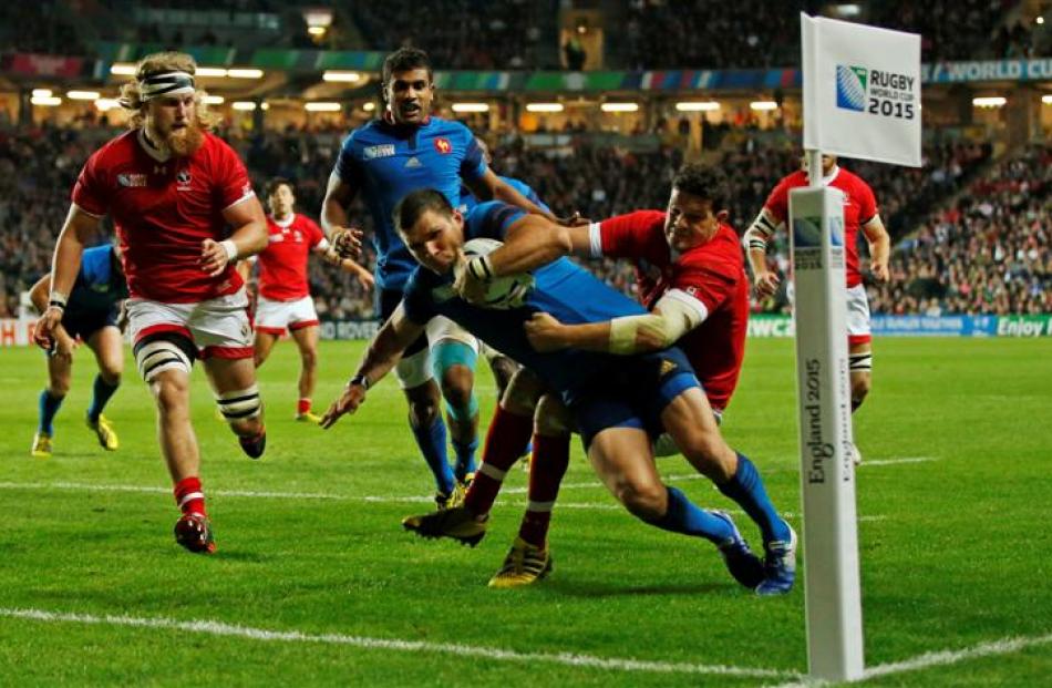 Winger Remy Grosso scores in the corner in France's 41-18 win over Canada. Photo: Reuters
