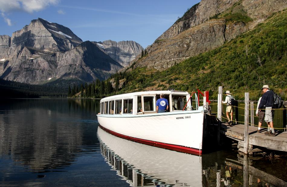 The Morning Eagle boat gets ready to explore Lake Josephine, in Montana's Glacier National Park....