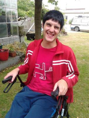Brad Timms with a walking frame earlier this year. Photo supplied