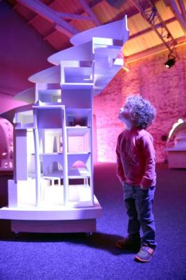 Austin Breese (4), of Dunedin, inspects a 3 D printed model of a facade for the Marisfrolg...
