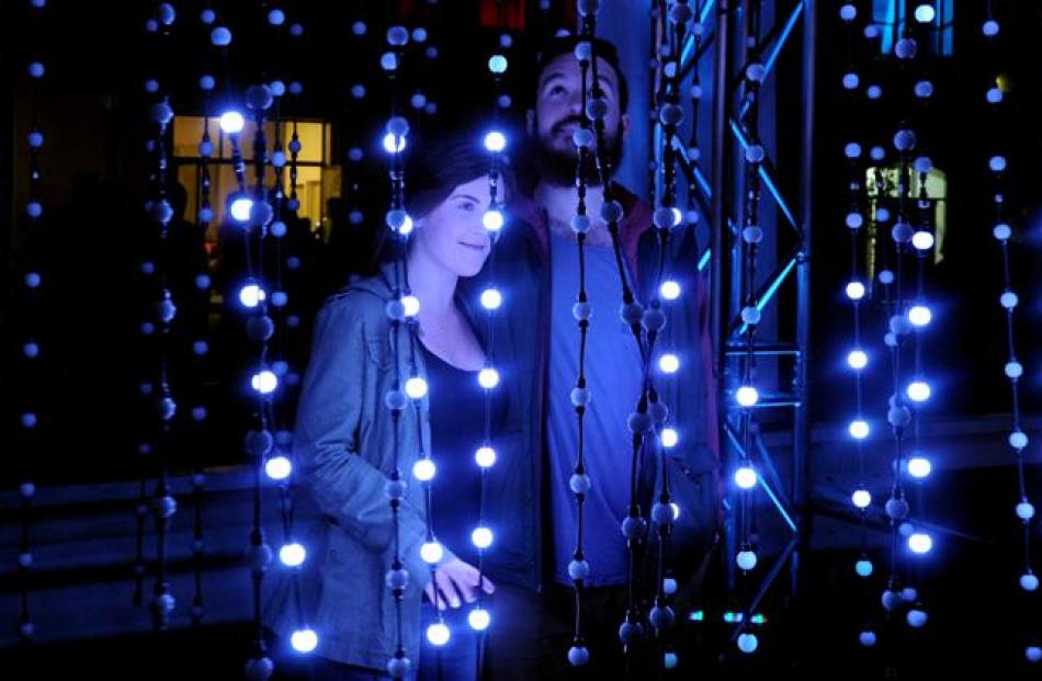 Nicole Parry and Codie Wayne from Dunedin take in  the party atmosphere on Saturday night. Photo...