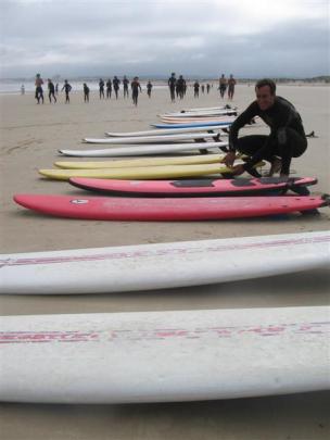Escola de Surf de Peniche surf school co-owner and surfing instructor Paulo Ramos gets ready for...