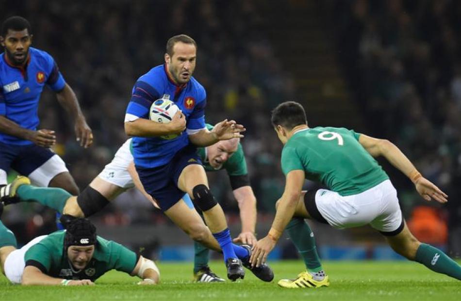 France first five-eighth Frederic Michalak on the run against Ireland. Photo: Reuters