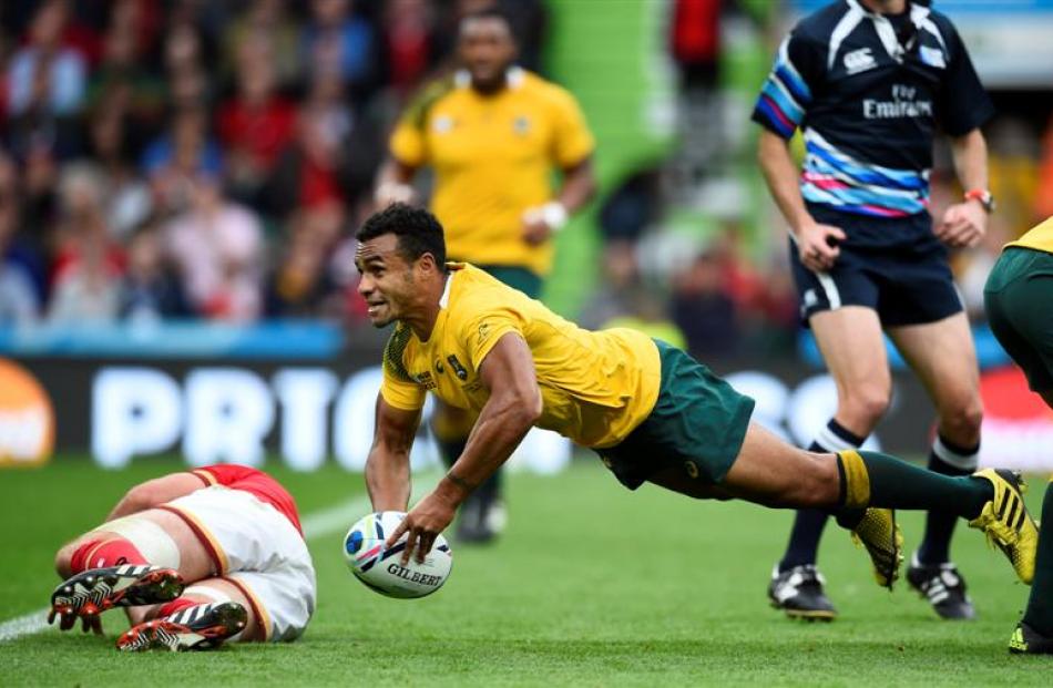 Will Genia performs a dive pass to deliver the ball to his backline during Australia's 15-6 win...