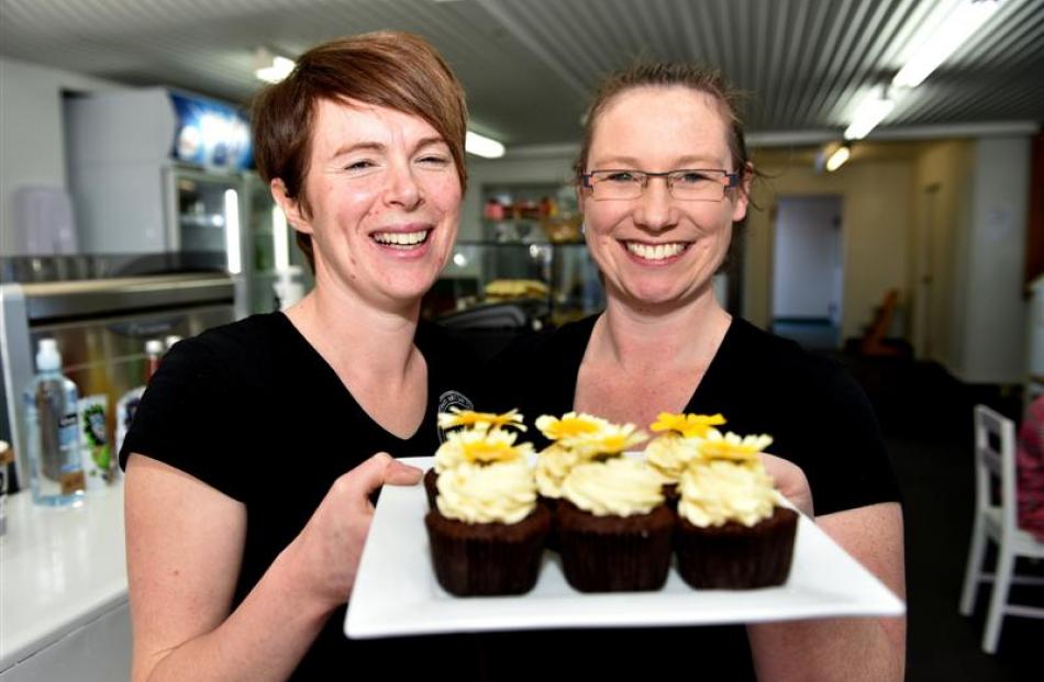 Wooden Table co-owners Kate Woodhouse (left) and Kelly Ennis, of Mosgiel, serve chocolate...