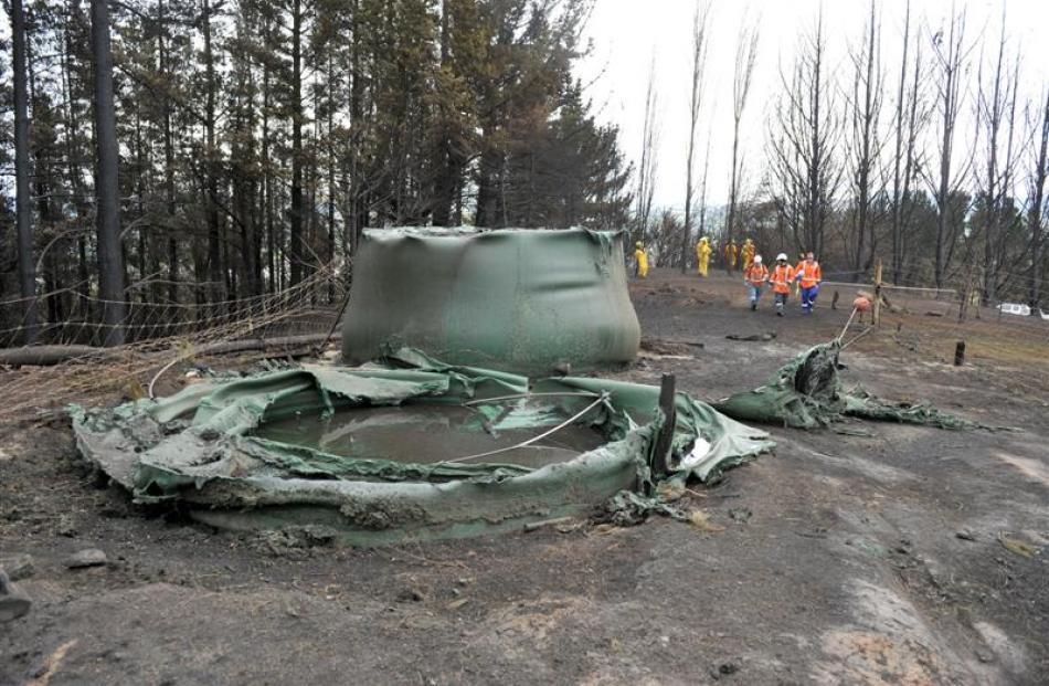 Melted water tanks on a Coalstage Rd property.