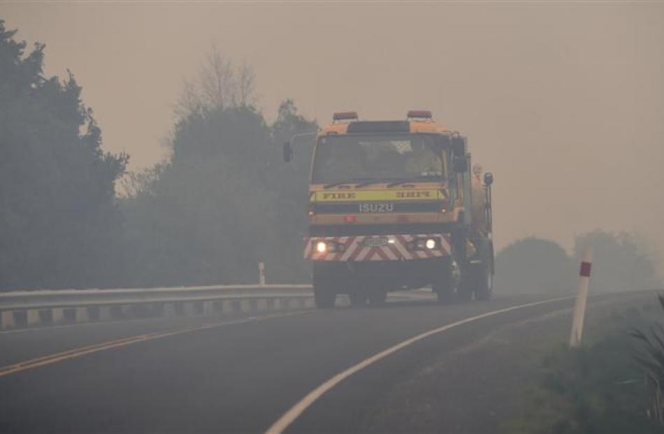 A water tanker travels along Morris Rd to battle the blaze on Wednesday. Photo by Peter McIntosh.