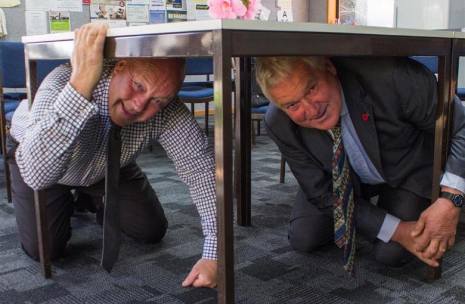 Clutha Mayor Bryan Cadogan (left) and deputy mayor Stewart Cowie get down and low for the...