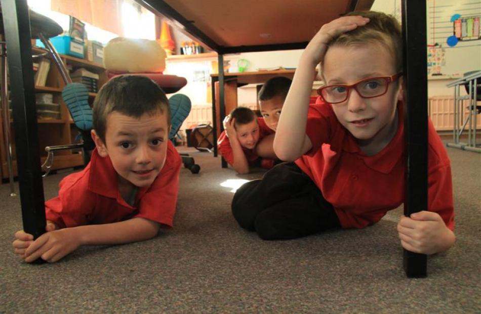 Practising earthquake preparedness drills are Oamaru North School year 4 pupils (from left)...