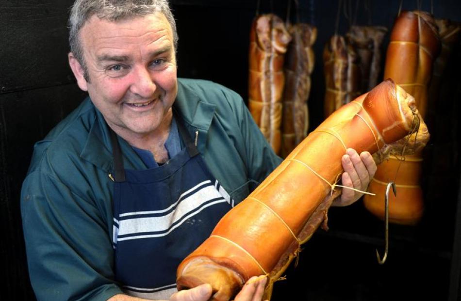 Ian Kennedy with some bacon fresh from the smoker at his new factory in the old Cherry Farm...