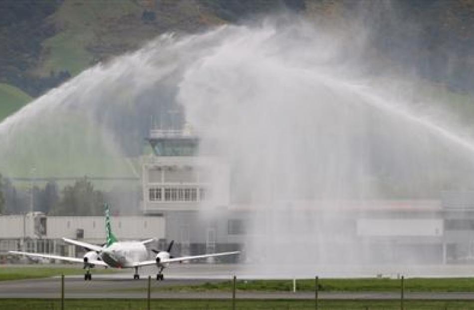 The Kiwi Regional Airlines flight is welcomed at Dunedin Airport before its flight to Queenstown.