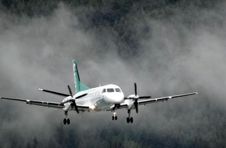 The Kiwi Regional Airlines Saab aircraft prepares to land at Queenstown Airport.