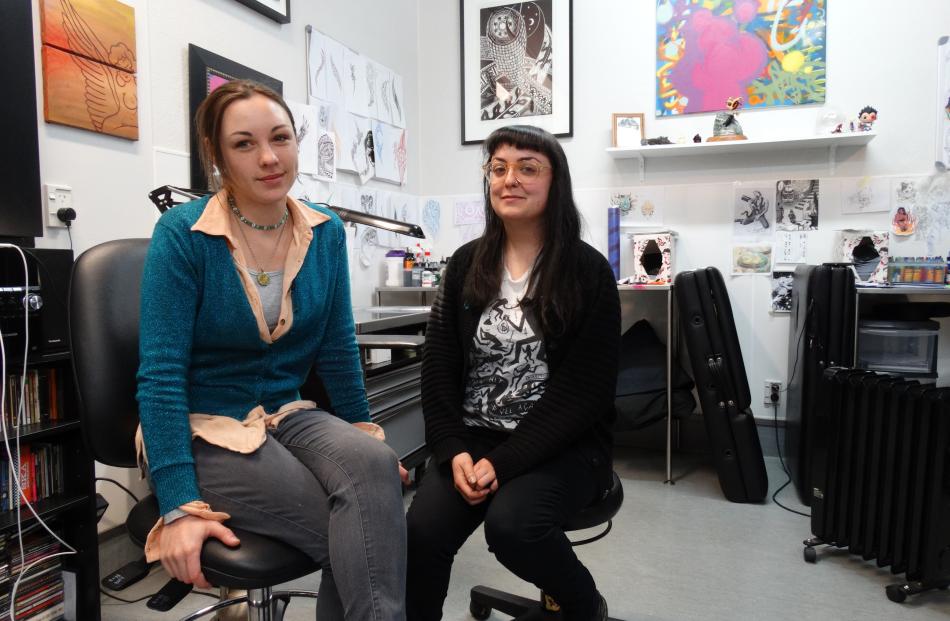 Tattoo artists Veronica Brett (left) and Devon Smith work at Agency Inc. Miss Brett   estimates...