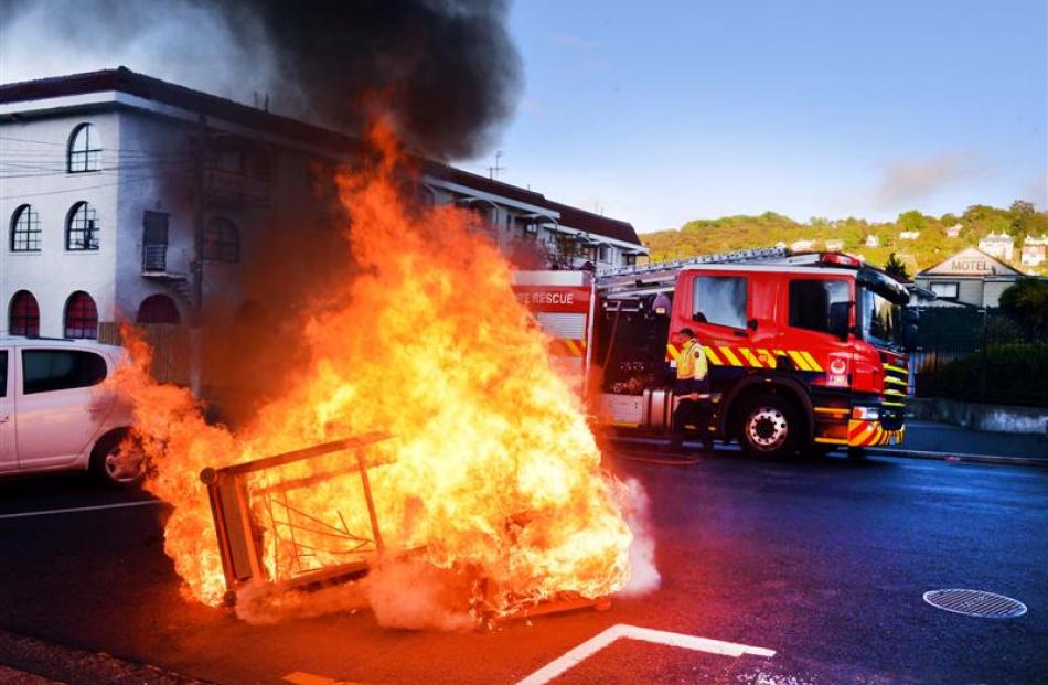 One of several North Dunedin couch fires draws the attention of the Fire Service yesterday...