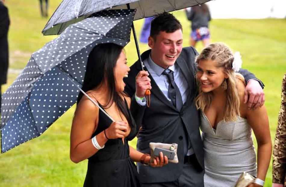 Lily Young (left) Sam Young and Kasara Miles at the Wingatui Melbourne Cup day.