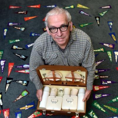 Michael Findlay with a travelling picnic set, part of the exhibition at the Hocken. Photo: Peter...