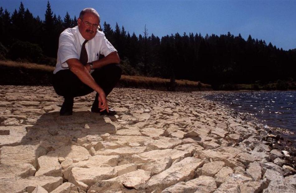 Then Dunedin City Council water manager Nigel Harwood observes the low level of Sullivan's Dam in...