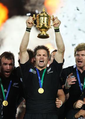 Victorious at last . . . McCaw lifts the Webb Ellis Cup after the All Blacks beat France 8-7 in...
