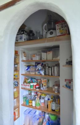 The former confessional has been converted to a pantry.
