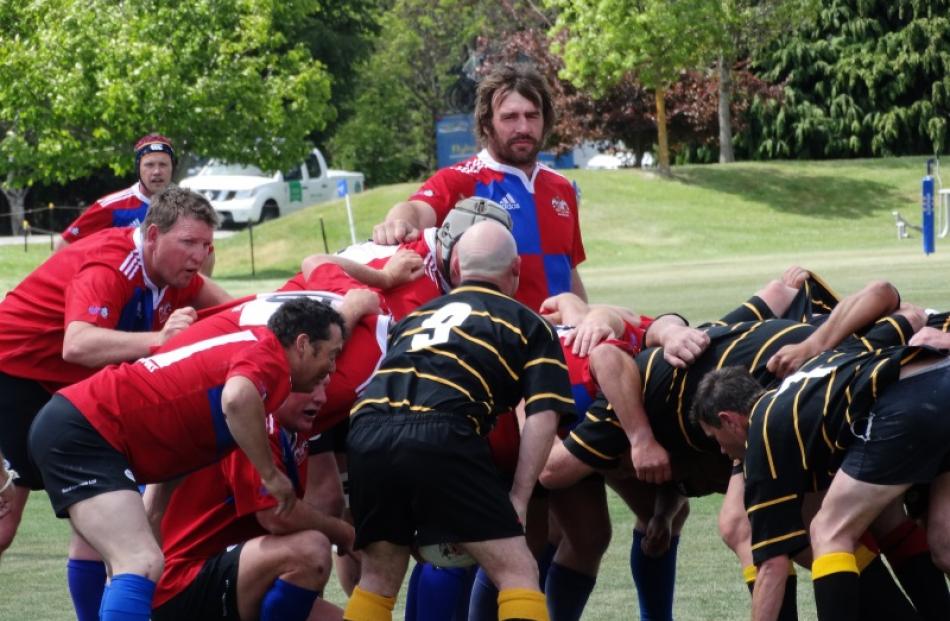 Former All Black Andrew Hore eyes up an opposition player during the Maniototo Blowflys game...