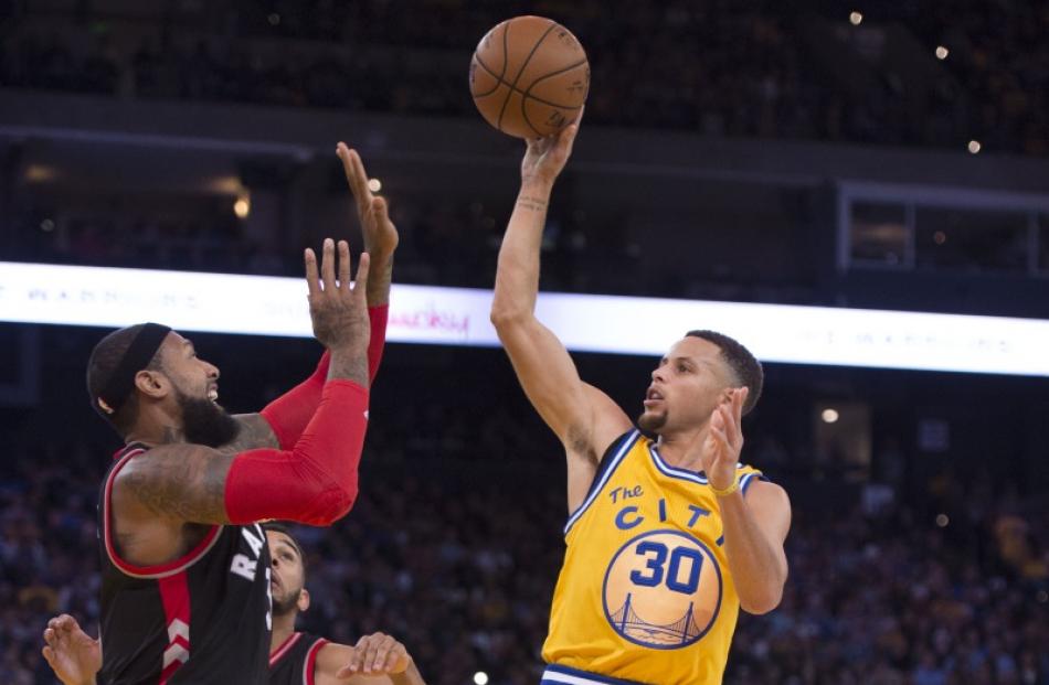 Stephen Curry puts up a floater during the Golden State Warriors win over the Toronto Raptors....