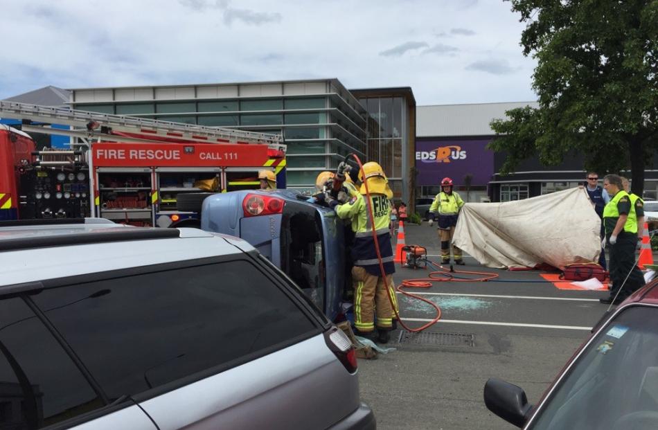 Emergency services attend a Dunedin crash which has left a person trapped in a car. Photo by Rhys...