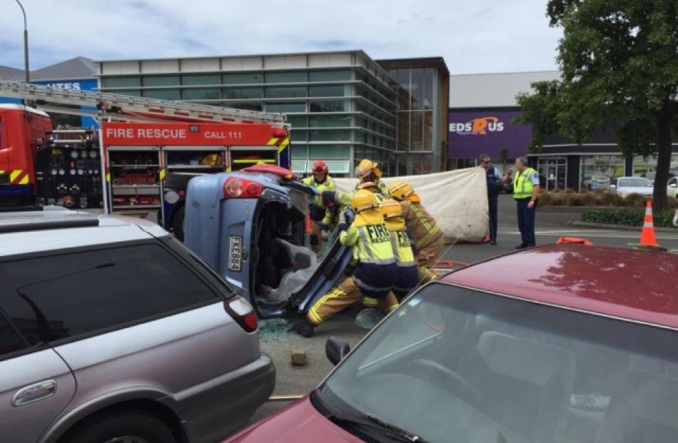 Emergency services attend a Dunedin crash which has left a person trapped in a car. Photo by Rhys...
