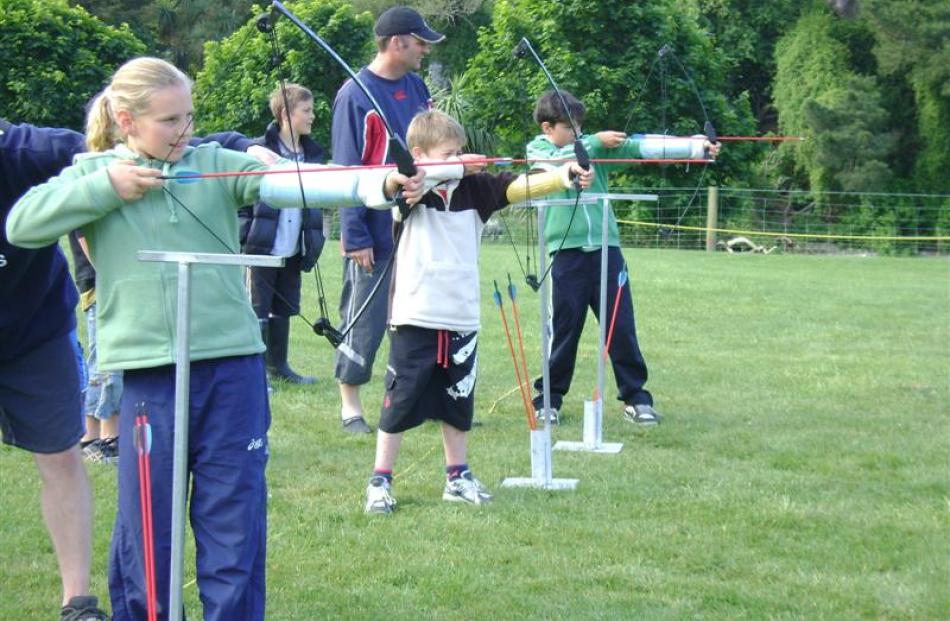 Taking aim during an archery session on a Grants Braes School camp at Waianakarua are (from left)...