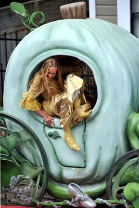 ''Cinderella'' Isabella Henderson (11) climbs into her giant pumpkin carriage.