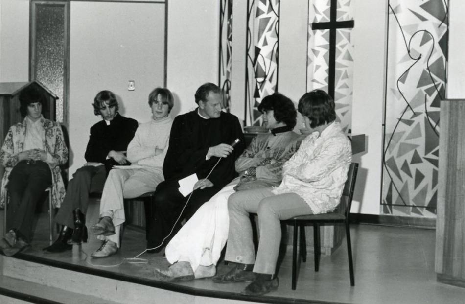 The Rev Ewing Stevens engages with young people at the Wakari Presbyterian Church in the 1960s.