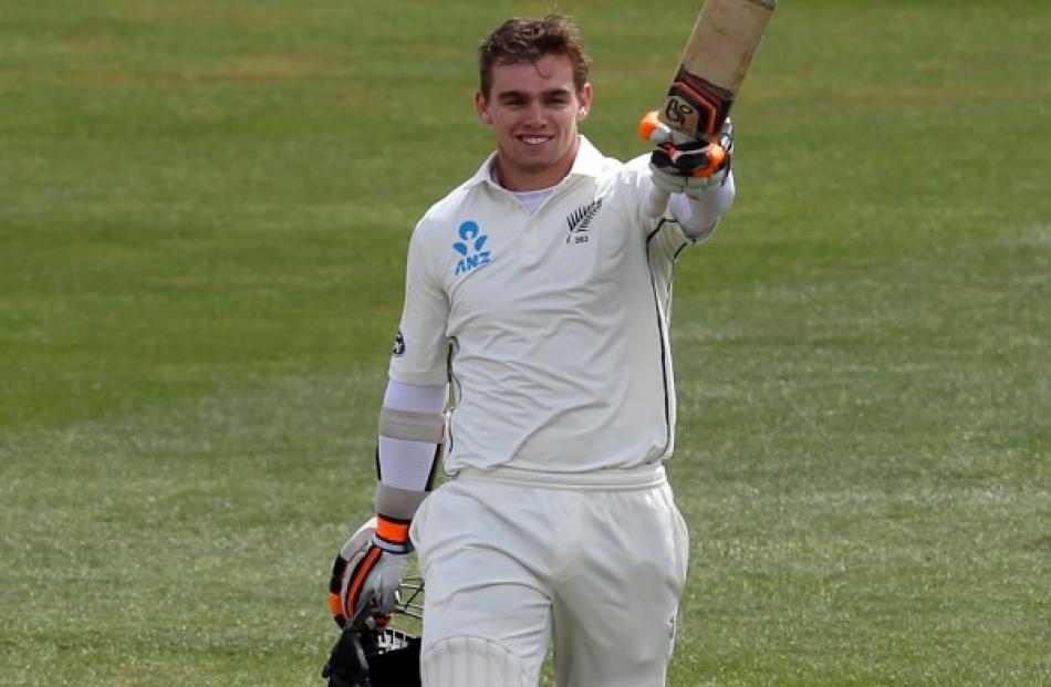 Tom Latham acknowledges the crowd after reaching his century. Photo Getty