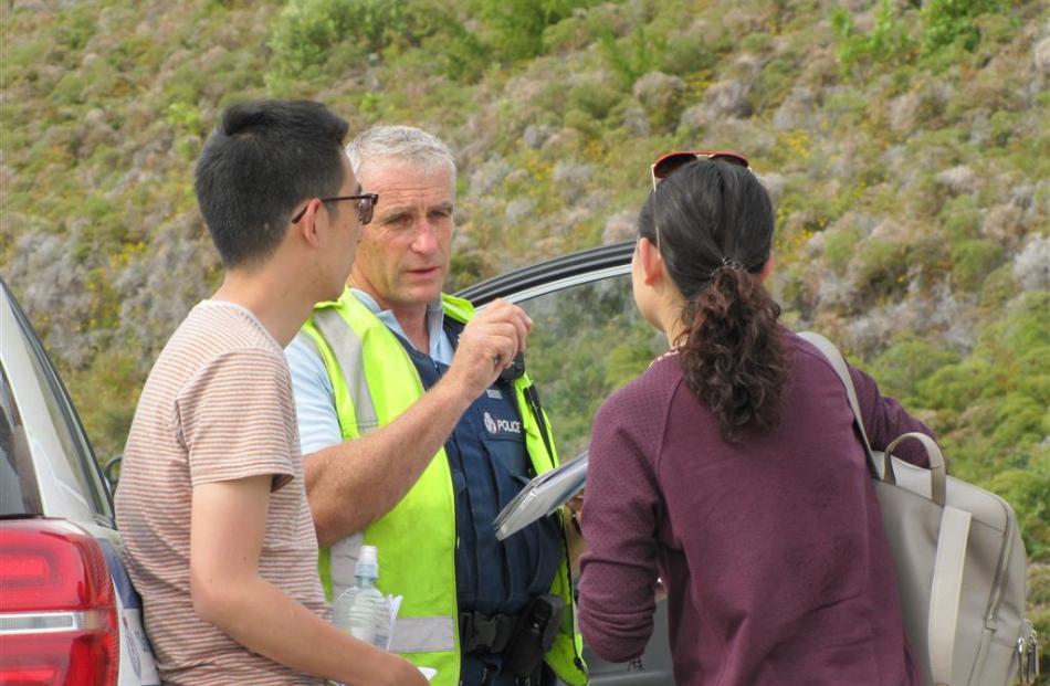 Shanghai tourist Ralph Feng is interviewed by Constable Greg Nolet.  Mr Feng’s wife is also...