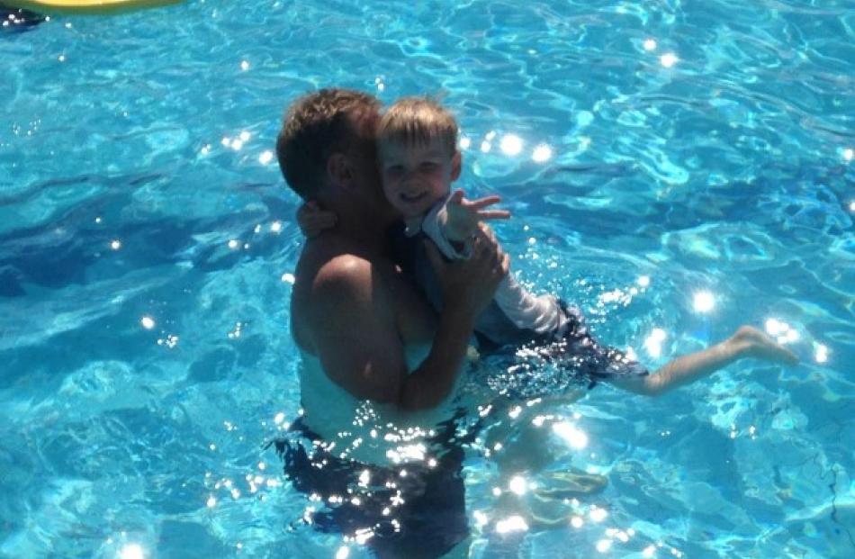 Riker Tabb cools down with his dad, Mike Tabb, at the St Clair Hot Water Pool. Photo Delaine Tabb