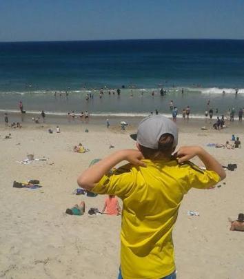 Wendy Elliott's son Cameron gets ready to hit the water at St Clair beach. Photo Wendy Elliott