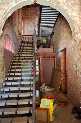 The stairway and atrium in the apartments’ entranceway, with the building’s brickwork still to be...