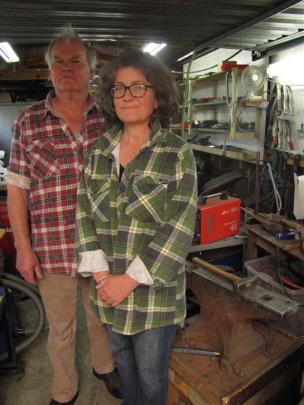 Forged and Crafted’s Bill and Michelle Clarke produce their work in their workshop garage in...