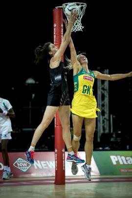 Silver Ferns goal shoot Bailey Mes (left) competes for the ball against Laura Geitz during the...