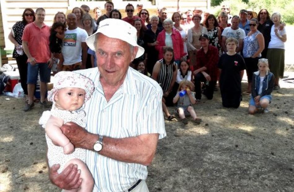 Paul Inder, the last living child of Mary and Albert Inder, holds Madalyn Ryan (5 months), the...