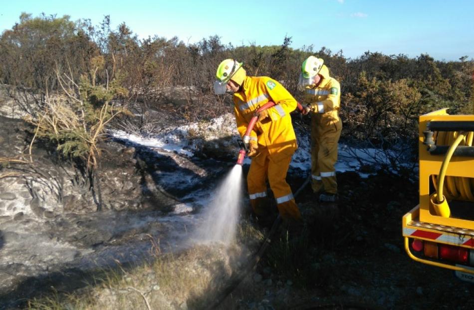 Fire fighters Ryan Fraser and Matthew Cullimore on the island. Photo supplied.