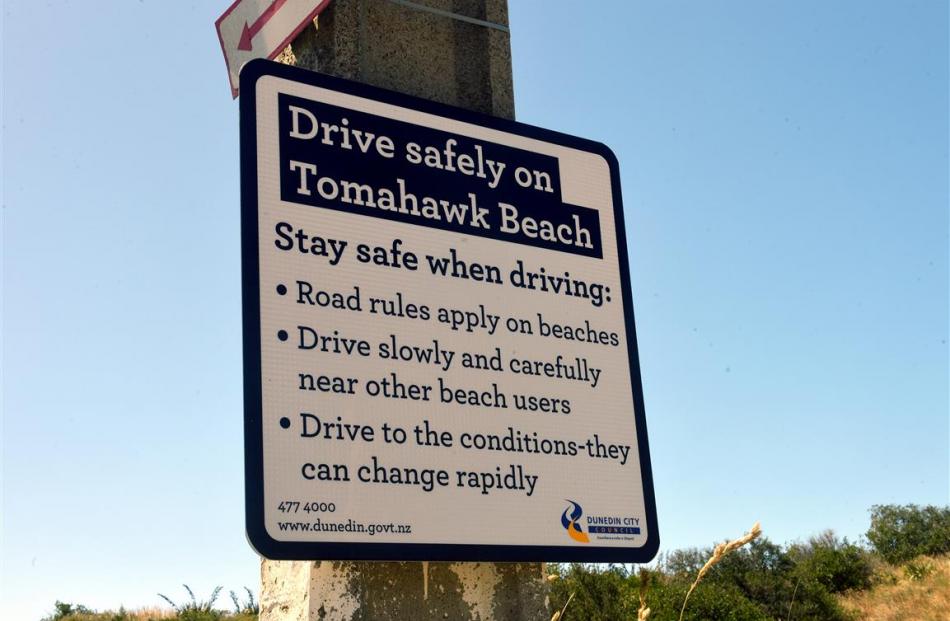 A sign detailing driving requirements for the beach.