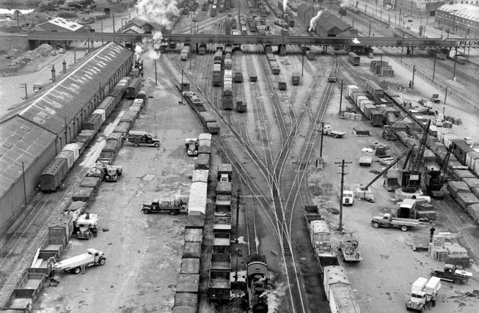 A photo from 1950 shows the old vehicle bridge cutting through Dunedin’s railway shunting yards....